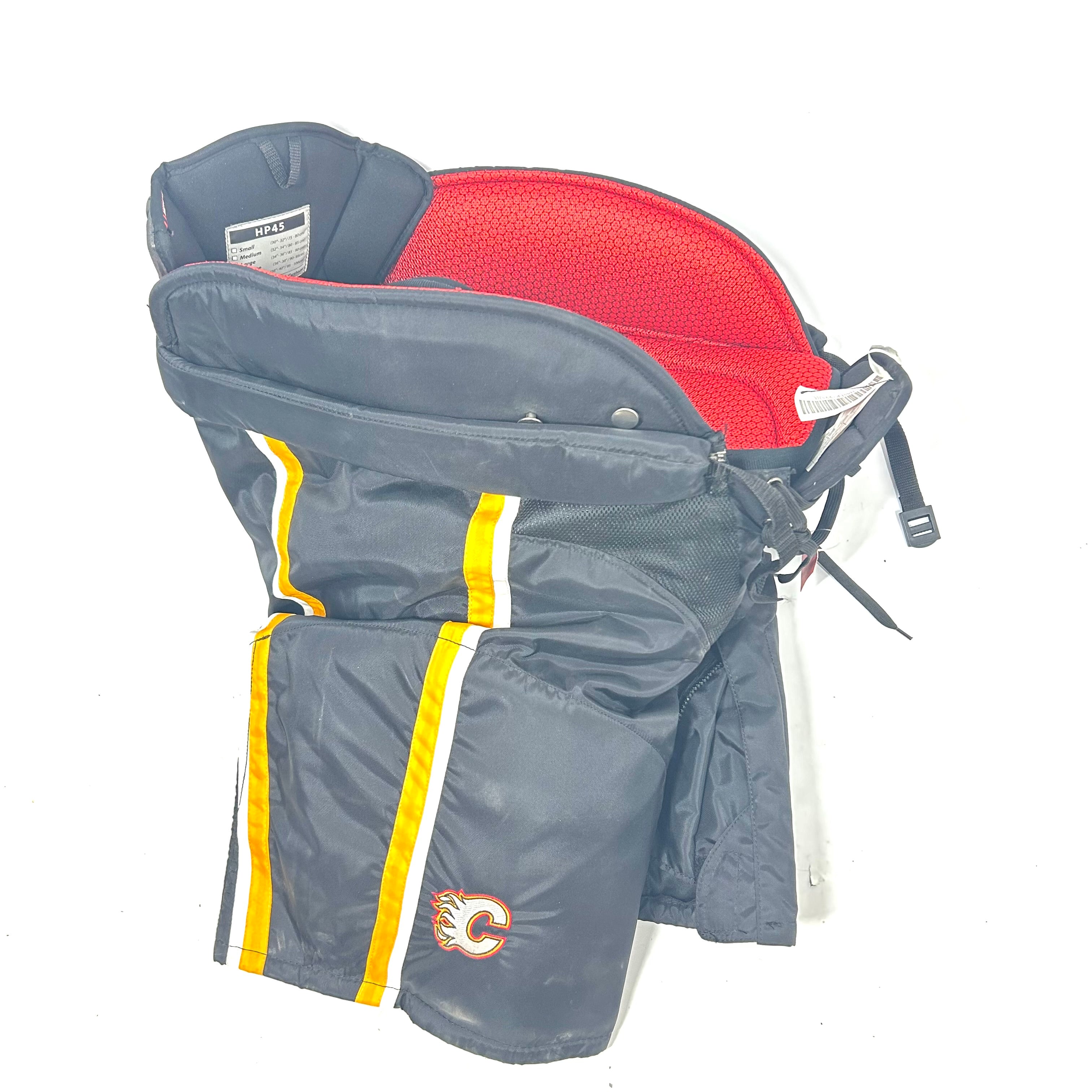 Pantalon de survêtement professionnel d'occasion de la LNH – CCM HP45 – Flames de Calgary (noir/jaune/blanc)